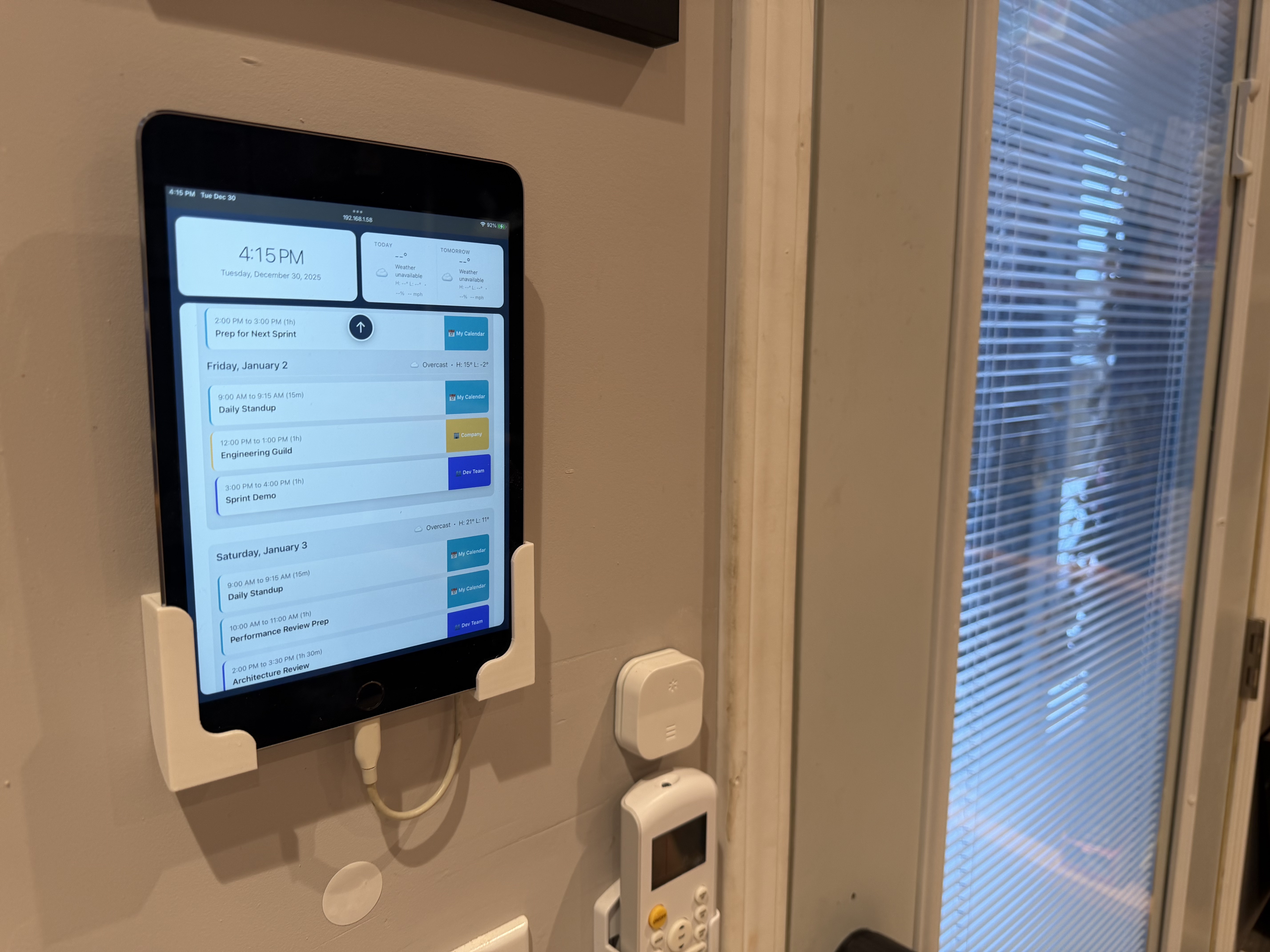 peeq dashboard on tablet mounted by door
